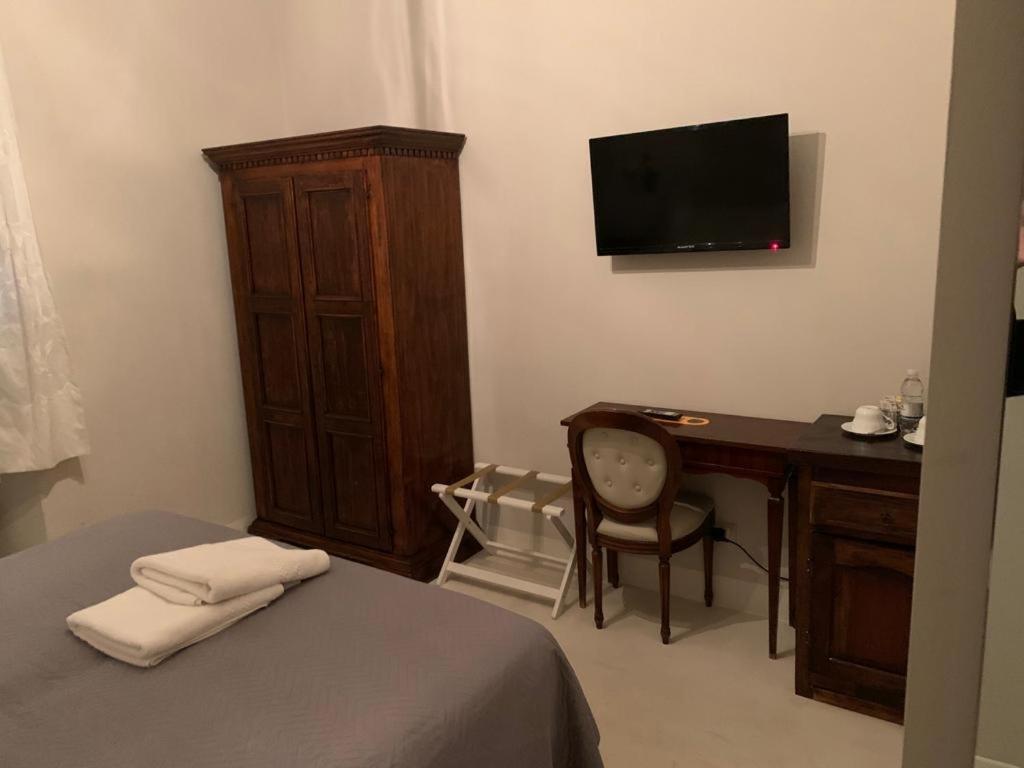Отель Relais Real Collegio Ноли Экстерьер фото